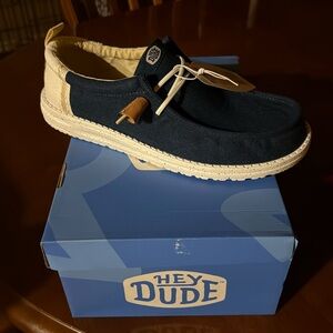 Brand new Men’s Hey Dude slip on shoes.